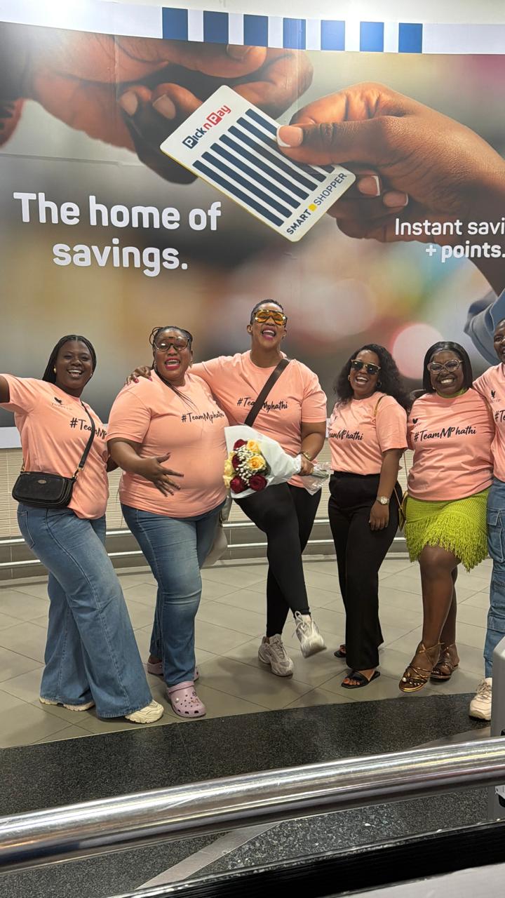 Mphathi with Team Mphathi members in matching shirts